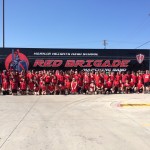 Happy students at Harker Heights High school after the delivery of their new semi Band Trailer!