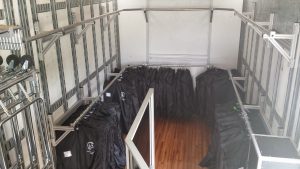 Coffee High School Marching Band Uniform Storage in Semi Equipment Trailer