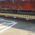 Easy Bellybox Storage of the Aluminum Loading Ramps for a High School Marching Band Semi Trailer