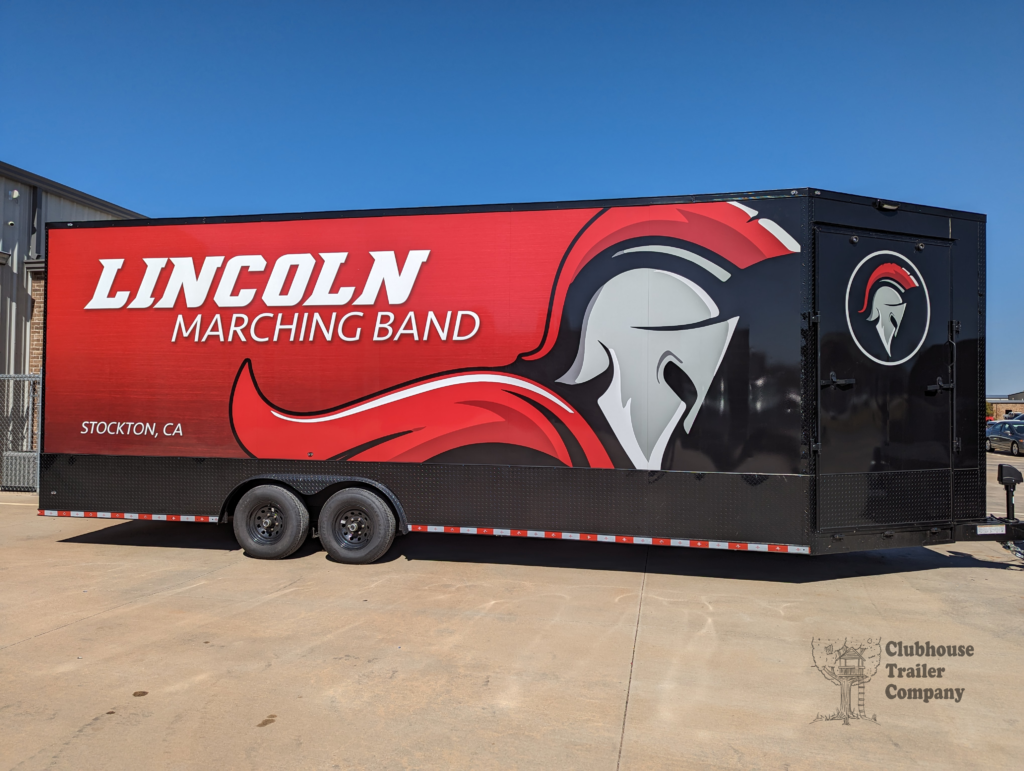 Lincoln High School marching band bumper pull trailer with custom designed graphic vinyl wrap. Storage for equipment, uniforms, and instruments.