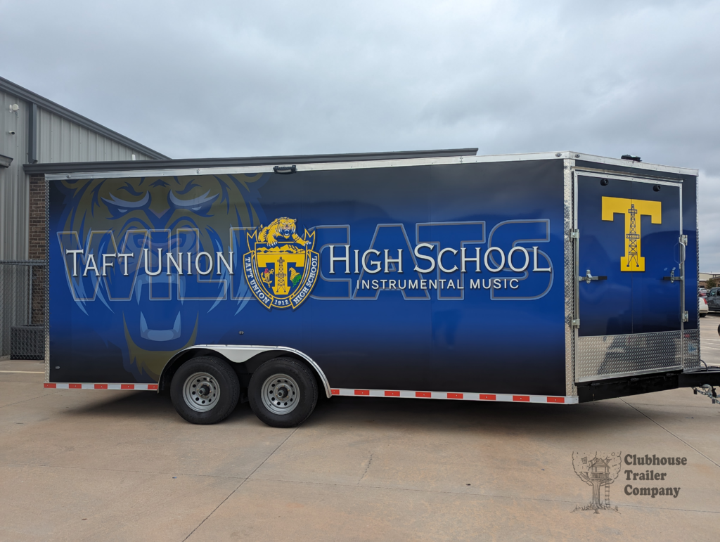 Taft Union High School marching band bumper pull trailer with custom vinyl wrap and second floor for storage and equipment.