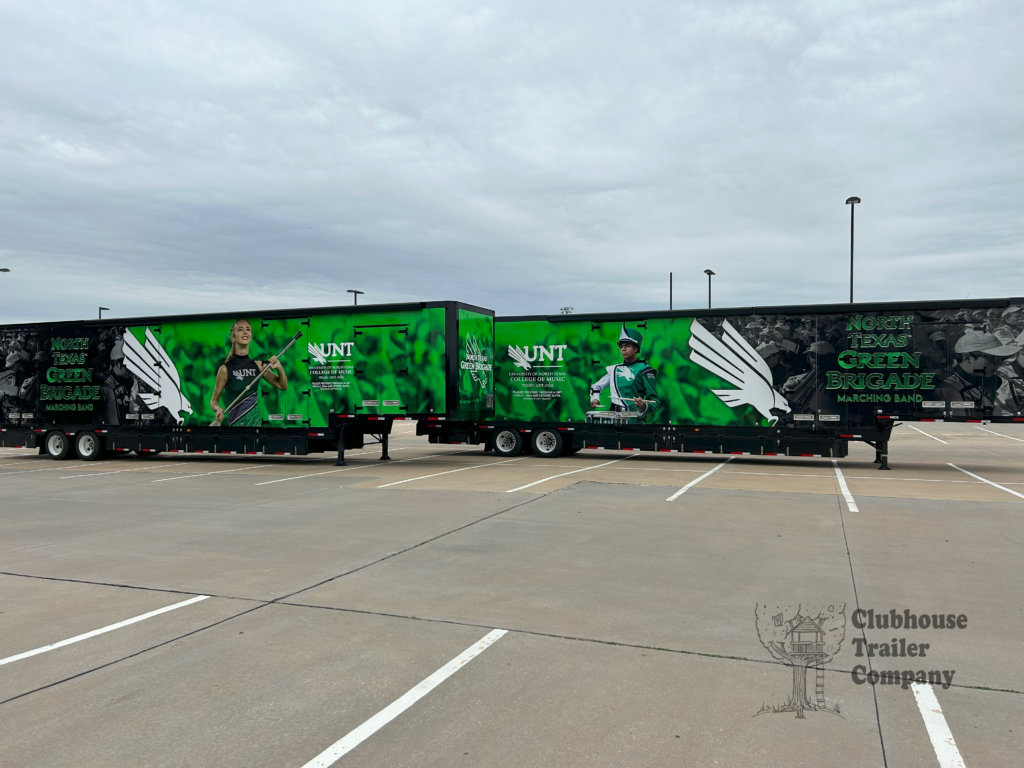 Two University of North Texas custom marching band trailers with vinyl wrap and full options.