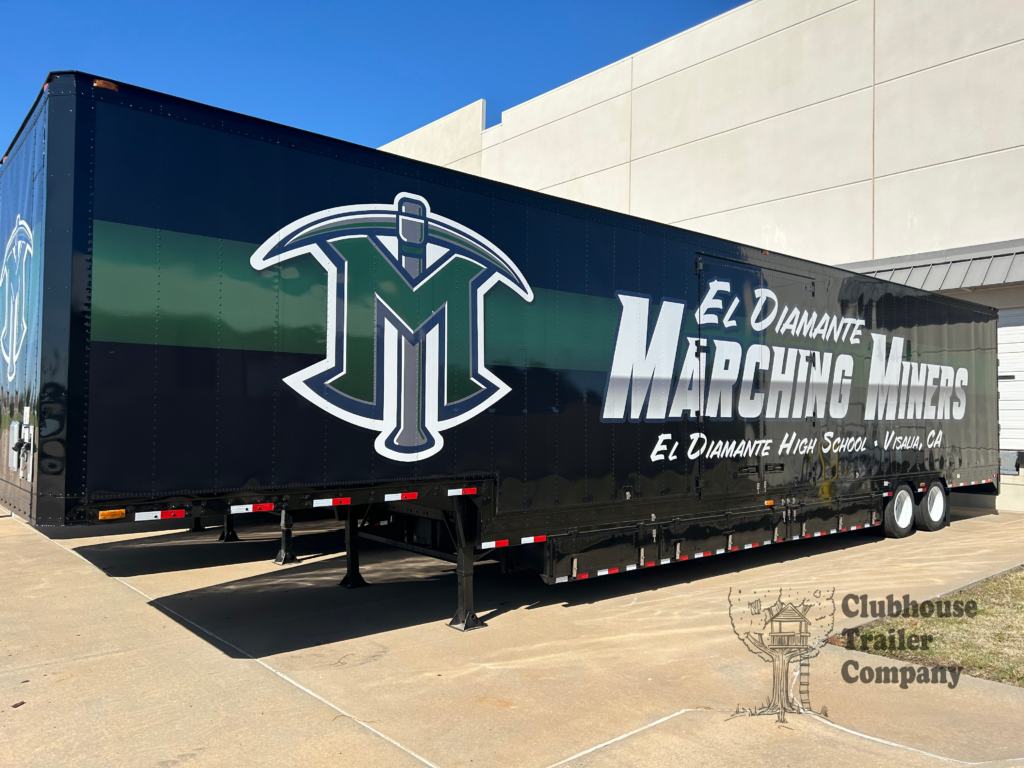 Al Diamante Marching band semi trailer with custom black and green vinyl wrap