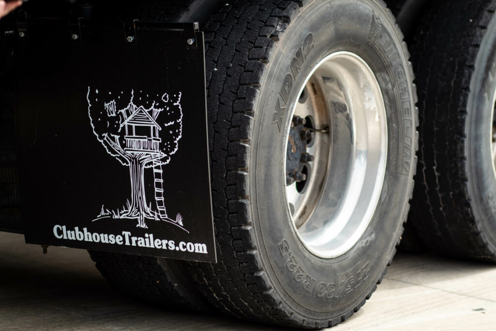 Clubhouse Trailer Company mud flap on semi tractor wheels