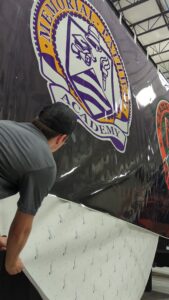 Installation process of custom vinyl wrap for all our marching band semi and small trailers