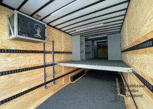 Interior of Clubhouse Small marching band trailer with second floor, drum wall, and instrument shelving