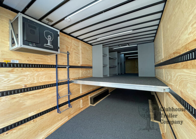 Interior of Clubhouse Small marching band trailer with second floor, drum wall, and instrument shelving
