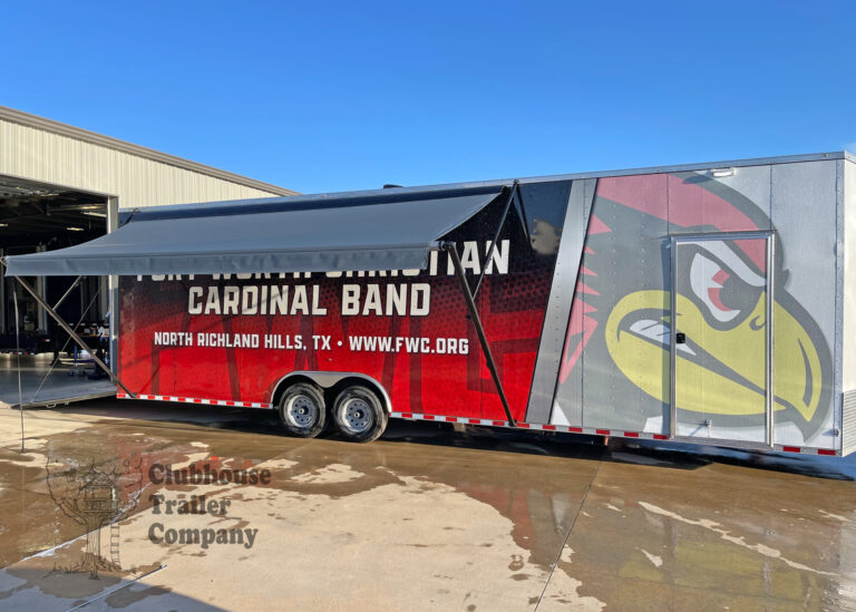 Exterior of marching band bumper pull trailer with awnings and vinyl wrap graphics
