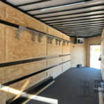 Bumper pull band trailer with uniform storage