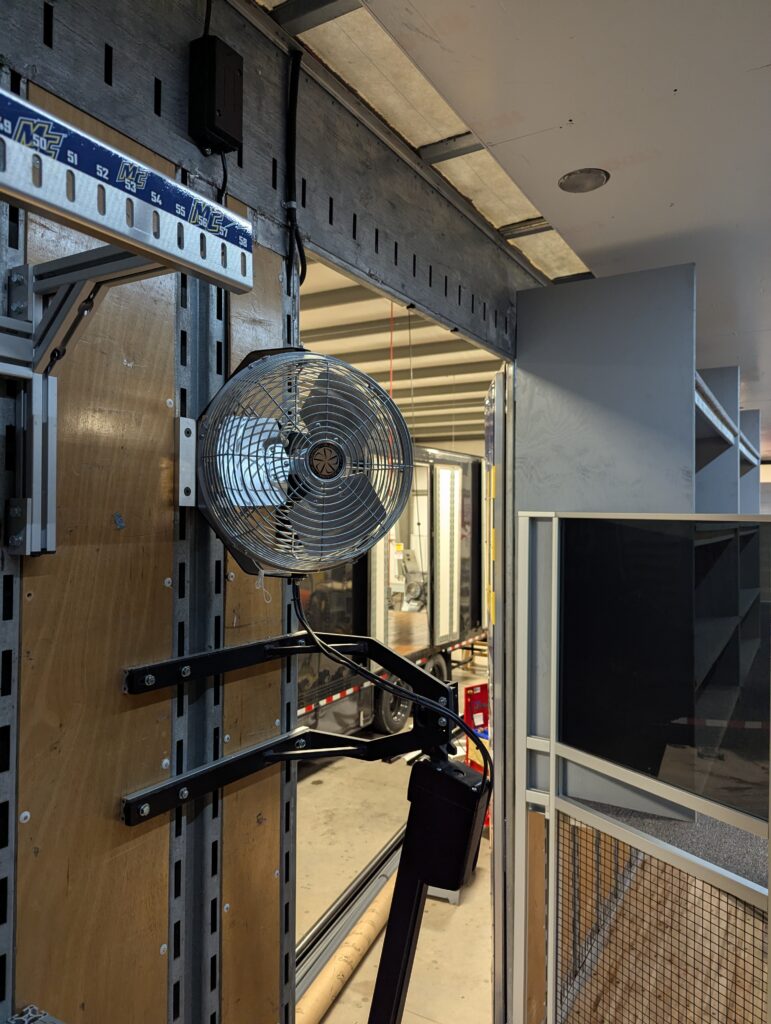 Fans mounted in marching band semi trailer.