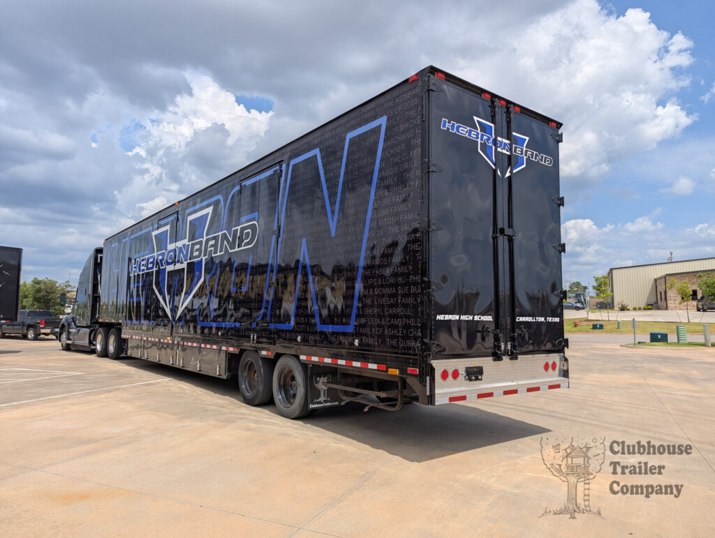 Hebron High School Marching band semi trailer with custom designed graphic wrap with flying carpet, drum wall, nose ramp, and manual stairs.