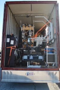 Semi Trailer for marching band high school loaded with towable front ensemble pit carts