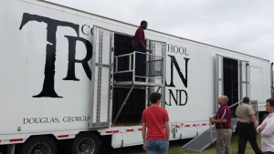 Clubhouse Trailer Company custom Director's Platform with front and side fencing. High School Marching Band Semi Trailer