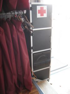 On this side of the Electrical Cabinet is a first aid cabinet, tool storage cabinet, and fuse panel. 