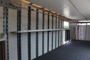 John Horn Band Semi Trailer with Folding Shelves Storage Solution
