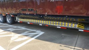 Easy Bellybox Storage of the Aluminum Loading Ramps for a High School Marching Band Semi Trailer
